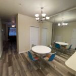 Dining room with white table and chairs.