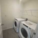 White washer and dryer in laundry room.