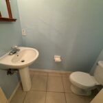 White sink and toilet in a bathroom.