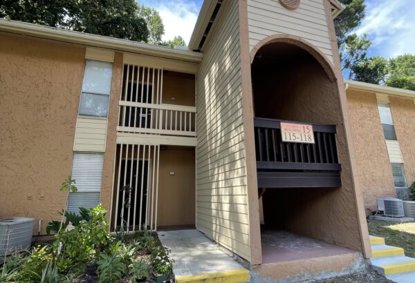Building 15 apartment entrance with steps.