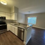 Modern kitchen with stainless steel appliances.