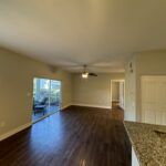 Empty living room with hardwood floor.