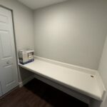 White countertop with a box on top.