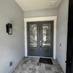 Double glass doors with patterned glass.