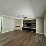 Modern living room with fireplace and TV.