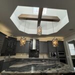 Modern kitchen with a skylight and island.