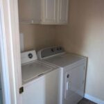 White washer and dryer in laundry room.