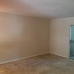 Empty living room with a sliding door.