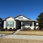 Craftsman style house, sunny day.