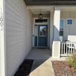 House entrance, teal door, number 1202.