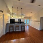 Modern kitchen with hardwood floors.